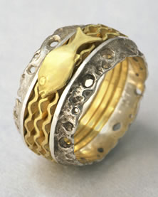 'Stacking Ring' in silver and gold with Damsel fish motif and Fine Waves in 18K gold.